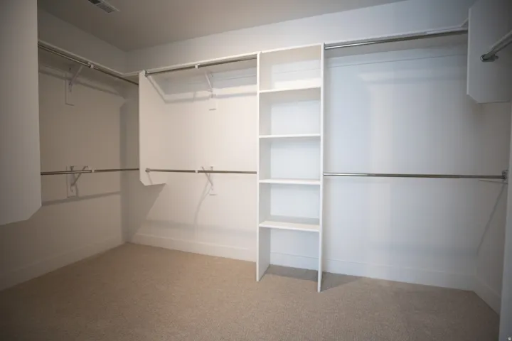 Large walk-in closet as part of primary suite.