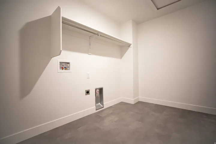 Full-size, dedicated laundry room.