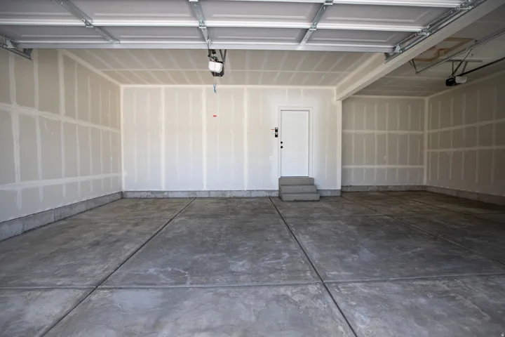Three car garage with taped finish.