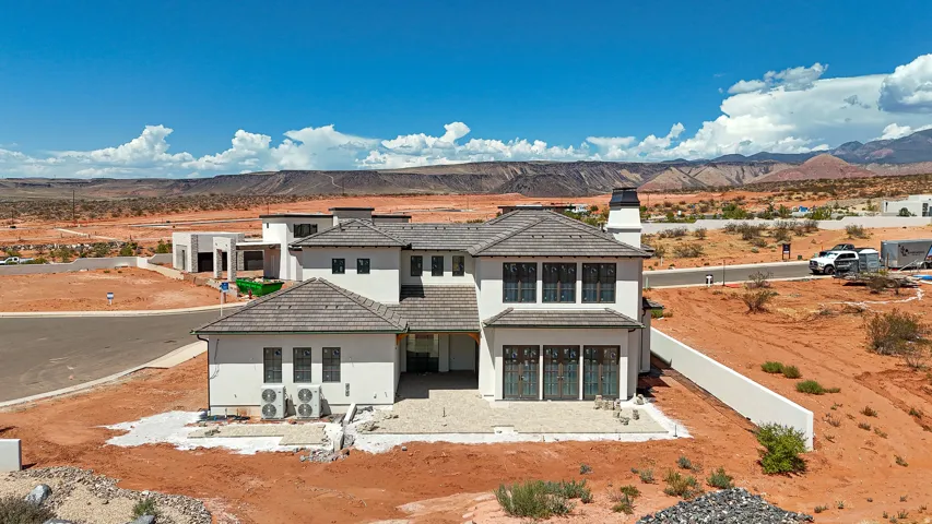 Contemporary architecture with a tile roof and stucco exterior