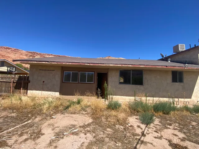 Stucco exterior with multiple windows