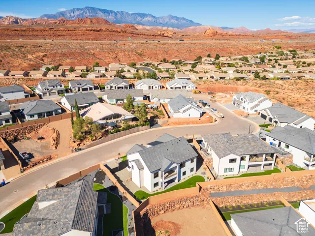 Residential neighborhood featuring varied architectural styles and mountain scenery