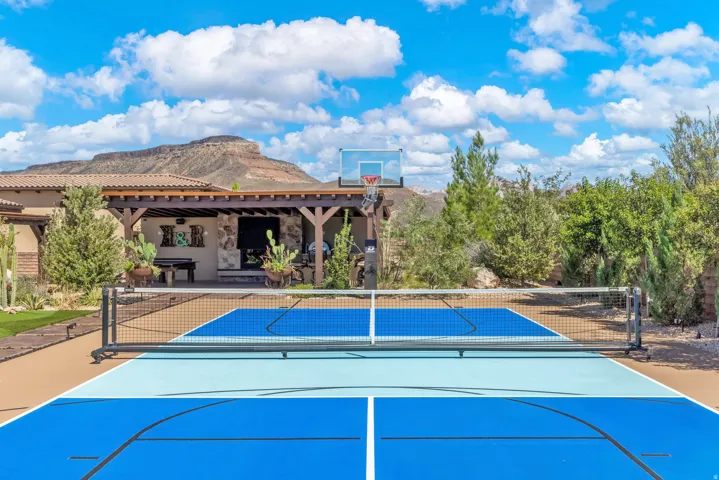 Multi-sport court with a basketball hoop and net