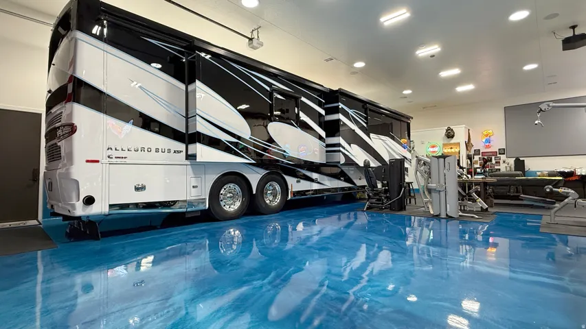 High-gloss blue epoxy flooring with recessed ceiling lighting