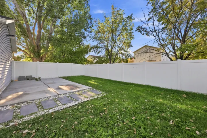 Private backyard with a concrete patio