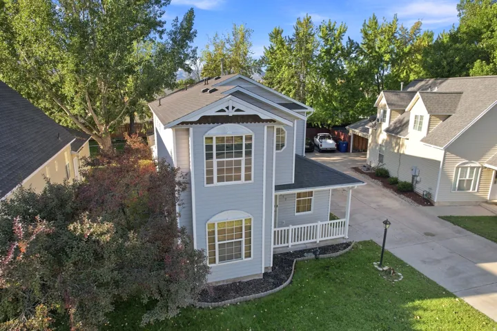 Two-story residential architecture with light blue siding