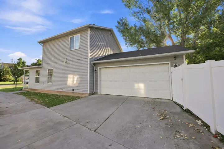 Two-story structure with horizontal siding and a two-car garage
