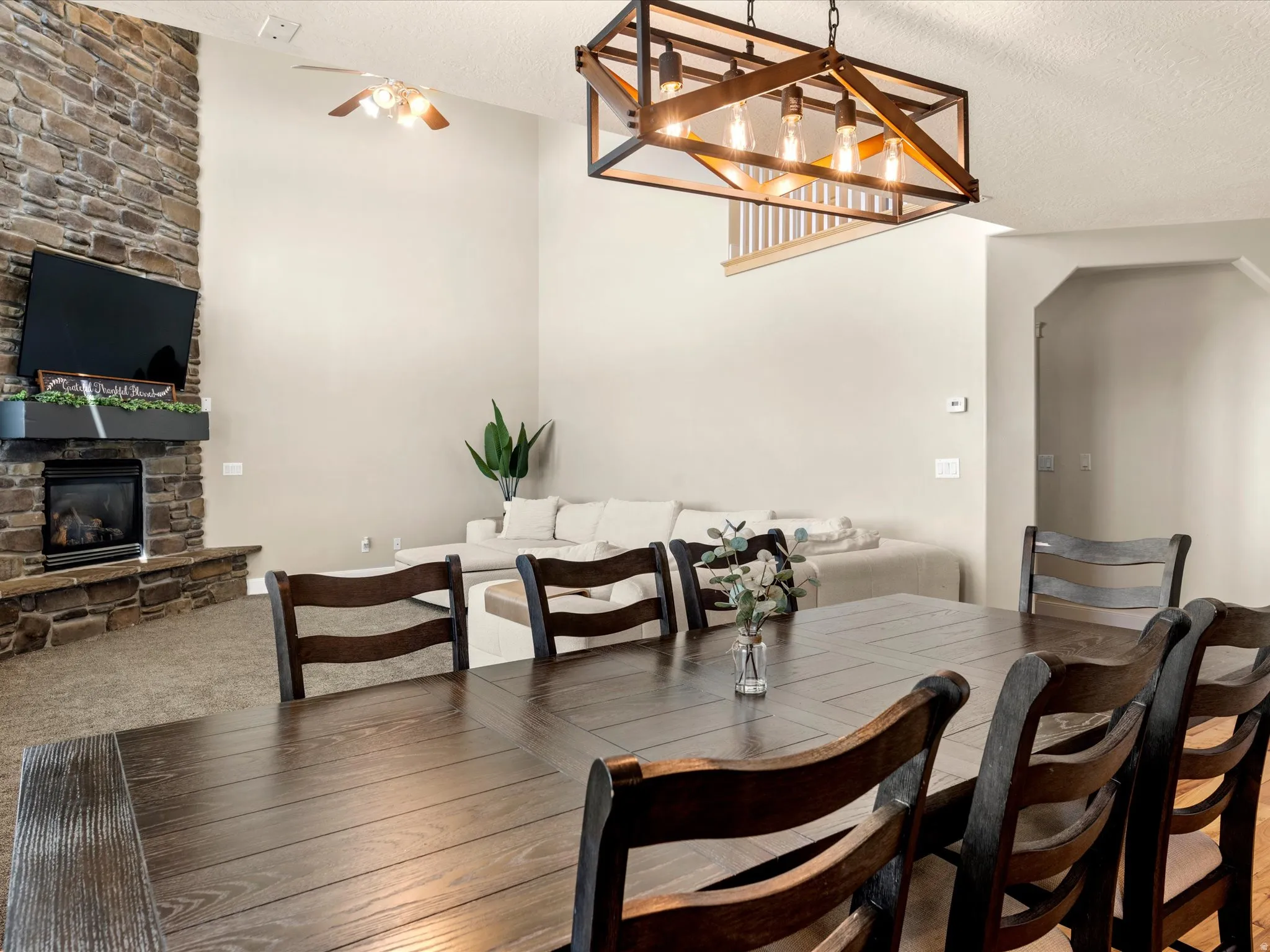 Stacked stone fireplace with a floating mantel