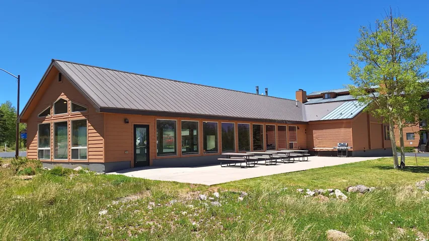 Wood-paneled exterior with a metal roof
