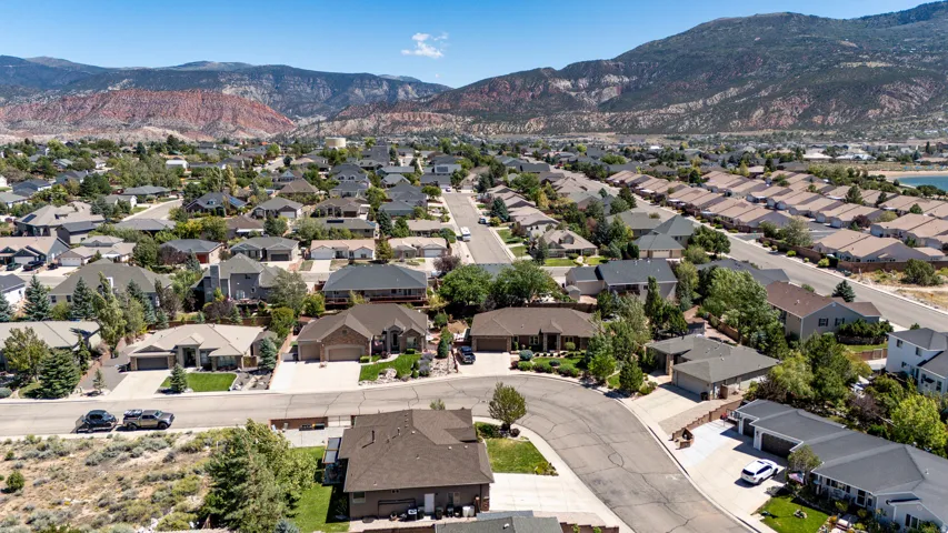 Aerial perspective showcasing residential properties within a developed neighborhood