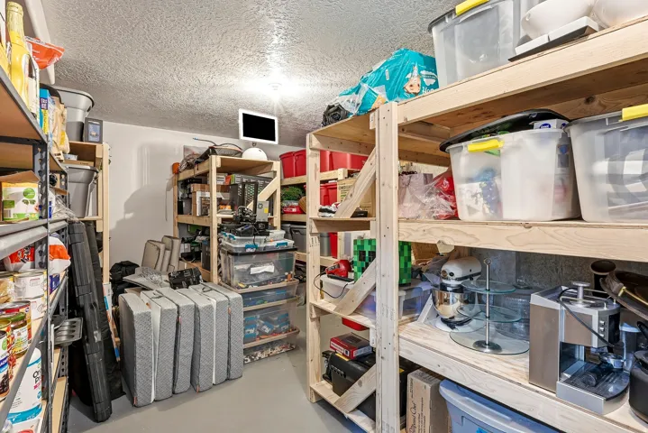 Extensive storage area featuring multiple shelving units and durable flooring