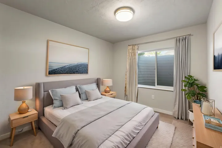 Recessed window with white trim, light-colored walls, and a ceiling-mounted light fixture