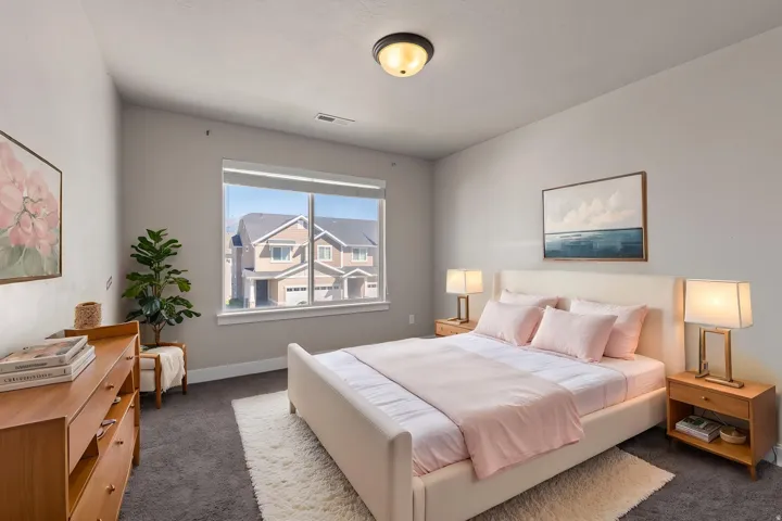 Spacious interior with carpet flooring, a large window, a built-in ceiling light, and light gray wall finishes