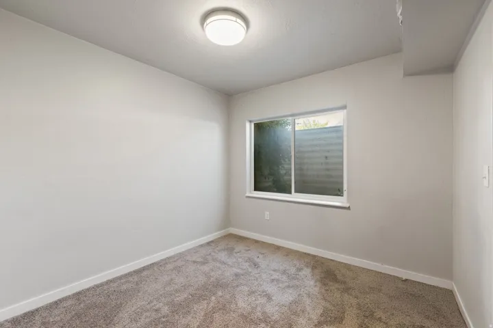 Light grey wall paint with coordinating carpet