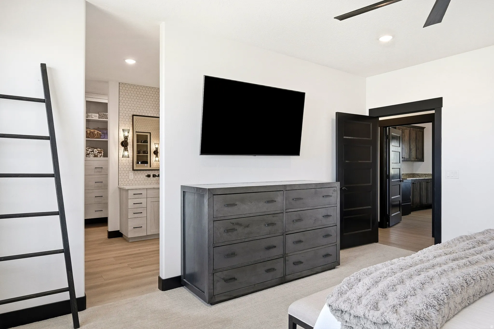 White walls with dark trim, recessed lighting, and a ceiling fan