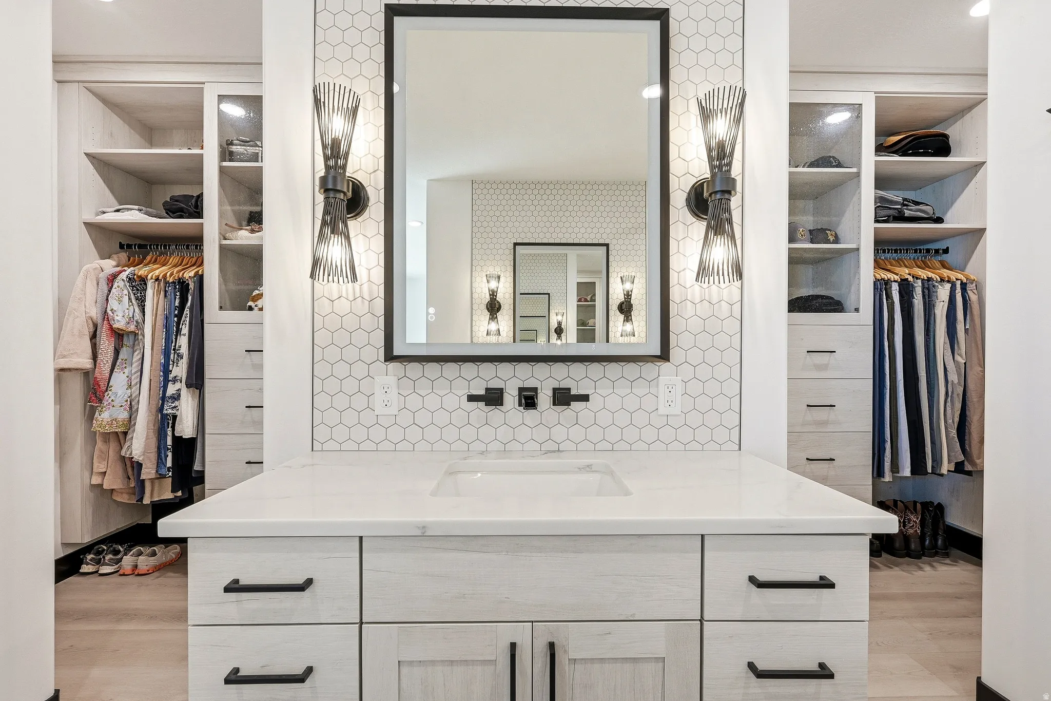 Custom built-in storage with adjustable shelving and hanging rods
