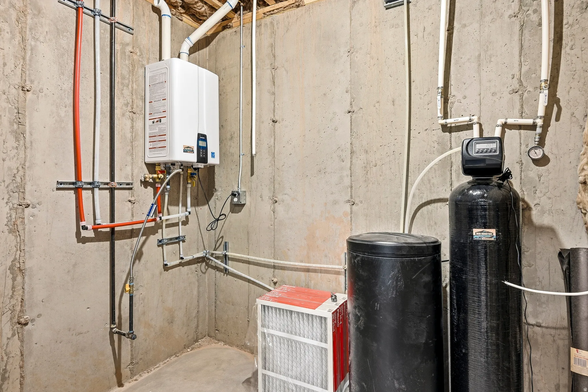 Tankless water heater and water softener system