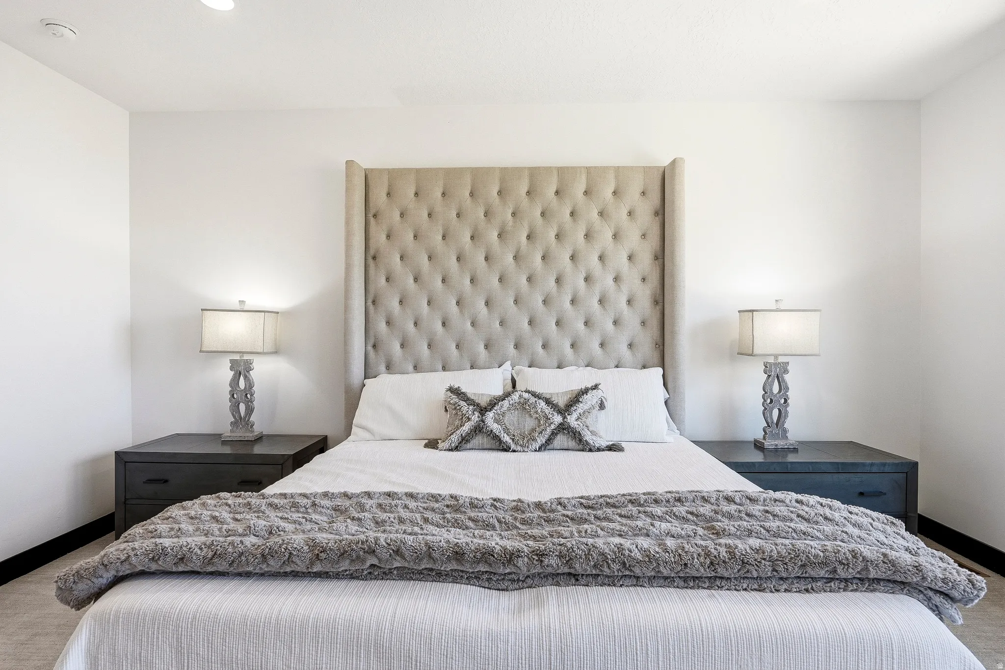 Recessed ceiling lighting complements the neutral wall color