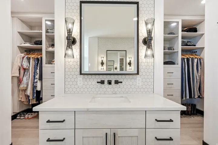 Custom built-in storage with adjustable shelving and hanging rods