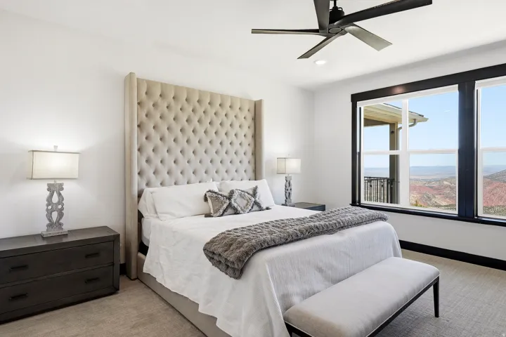 Large windows with dark trim, recessed lighting, and a ceiling fan