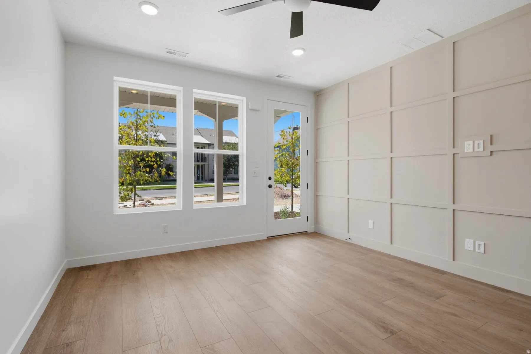 Wood-finish flooring, recessed lighting, and a ceiling fan