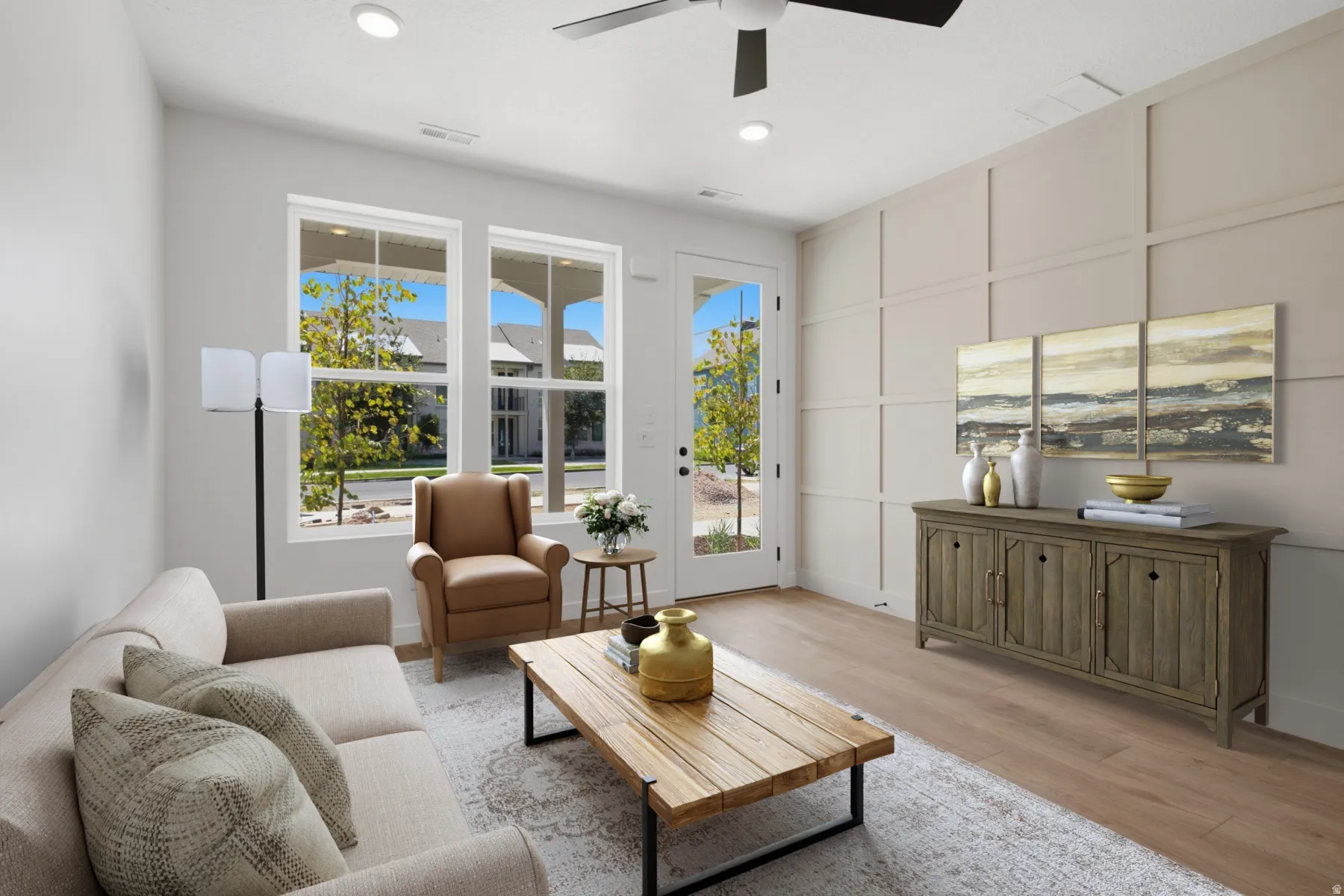 Recessed lighting, ceiling fan, wood-finish flooring, full-light door, and grid accent wall
