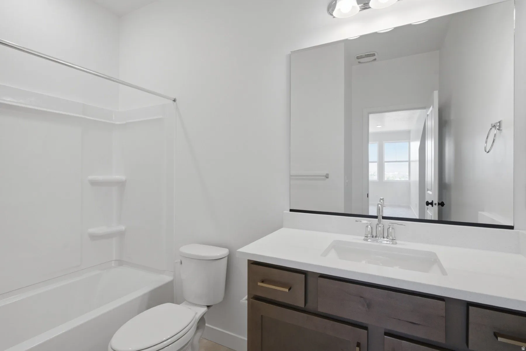 White fiberglass tub and shower combination