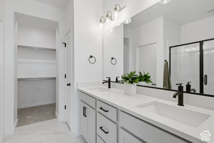 Double vanity with integrated sinks and matte black fixtures