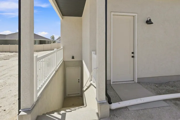 Exterior stucco finish with a contrasting dark soffit