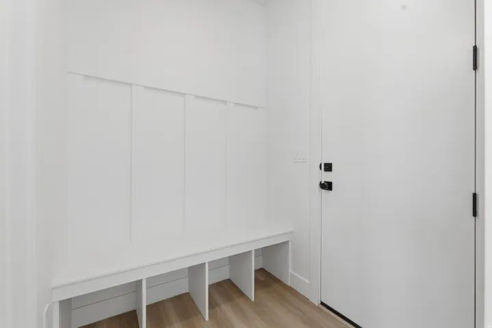 Built-in bench with storage cubbies and vertical paneling