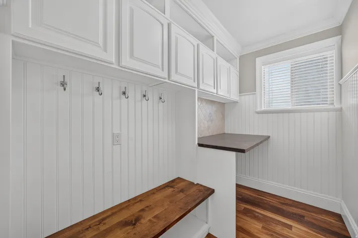 White cabinetry and beadboard paneling