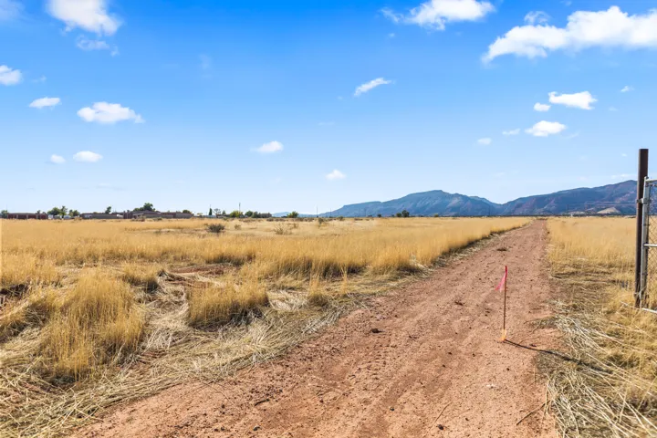 Expansive open terrain with a dirt path
