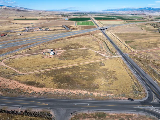 Expansive undeveloped land featuring multiple roads and highway access