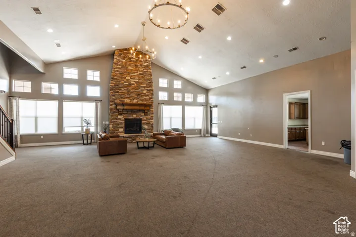 Vaulted ceiling with dual chandeliers and recessed lighting