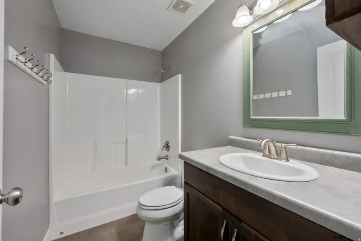 White bath/shower combination with a single handle faucet