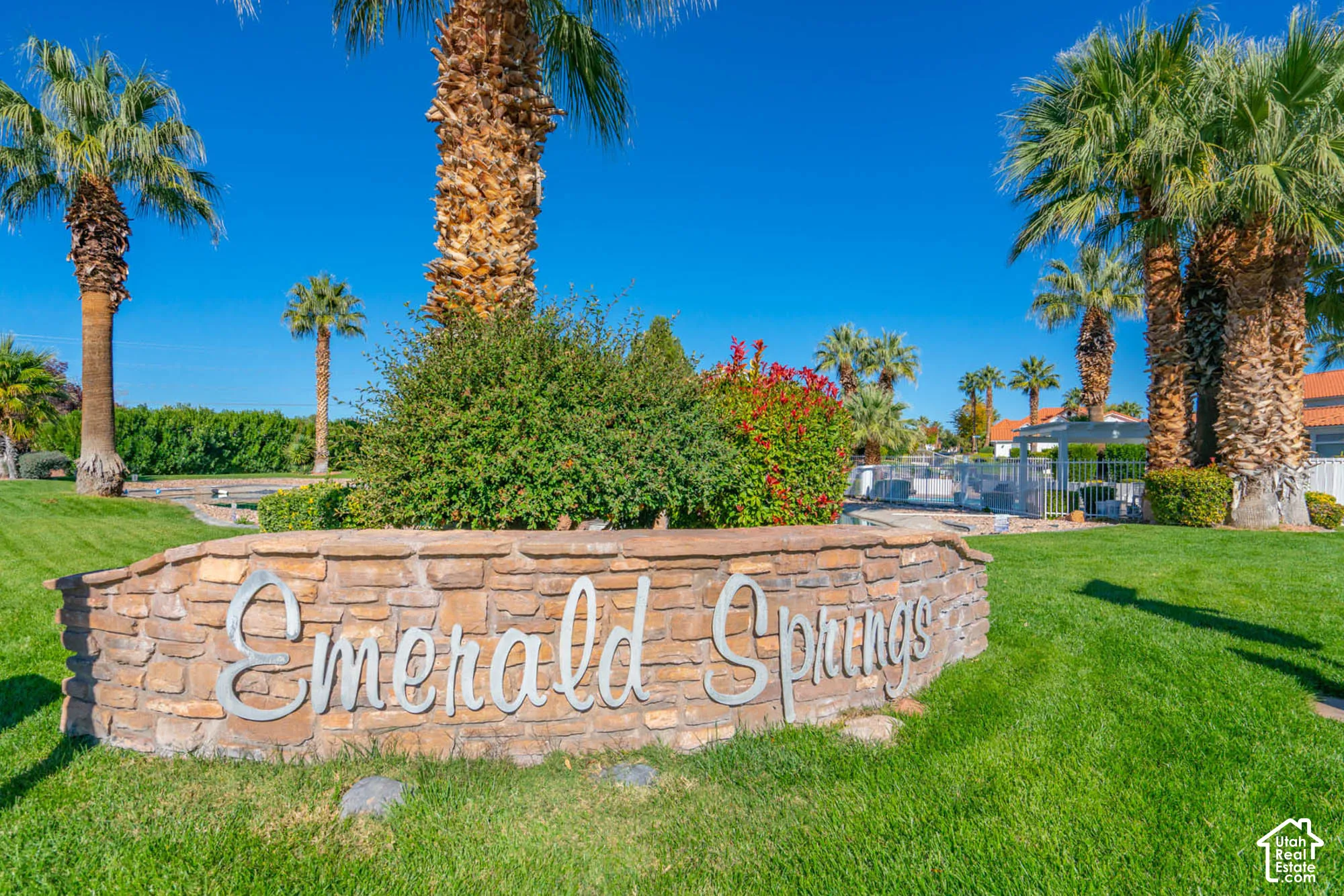 Stone-clad entry monument with dimensional lettering