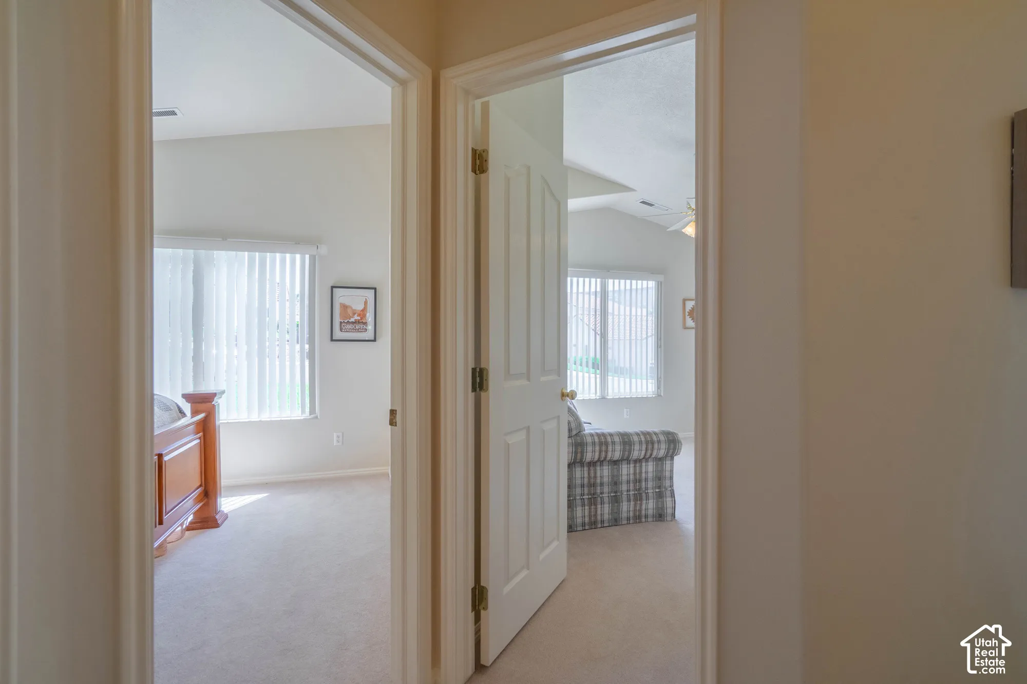 Neutral tone wall paint with light-colored carpeting throughout