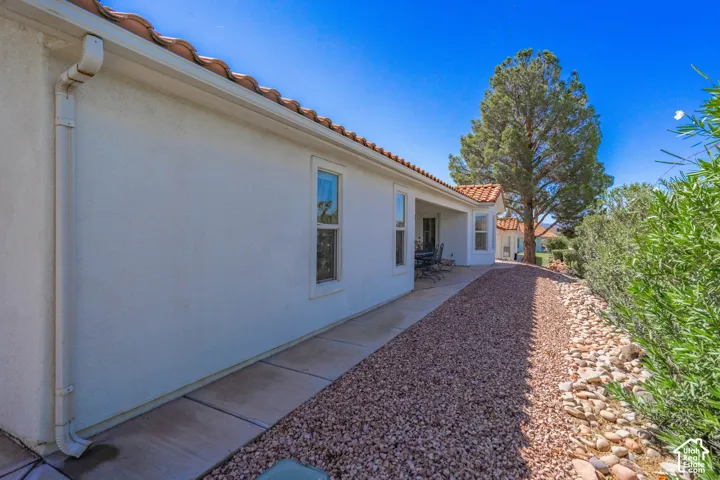 Stucco exterior with a tiled roof