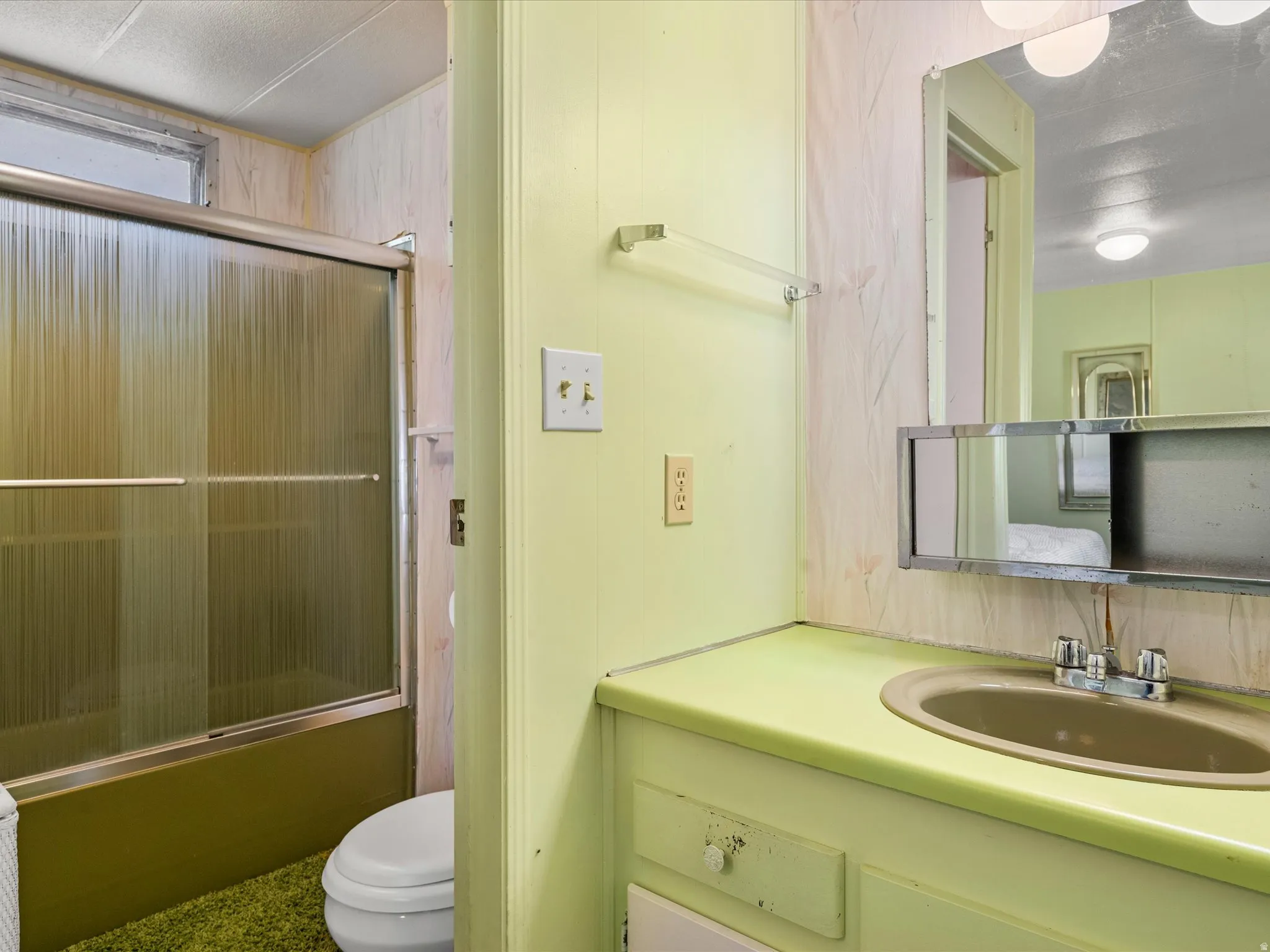 Built-in vanity with integrated sink, chrome faucet, and mirrored medicine cabinet
