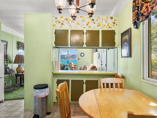 Pass-through window and upper cabinetry above a built-in counter