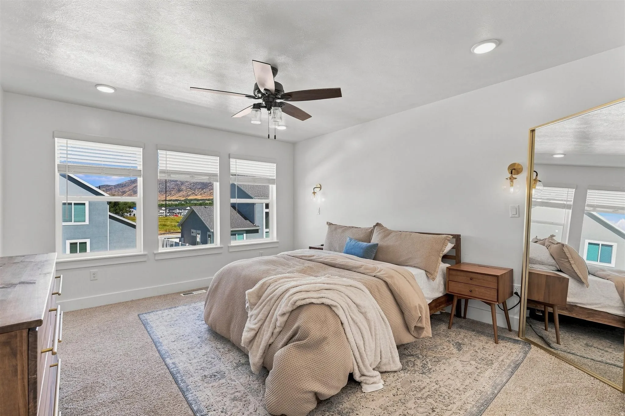 White walls with recessed lighting and a ceiling fan