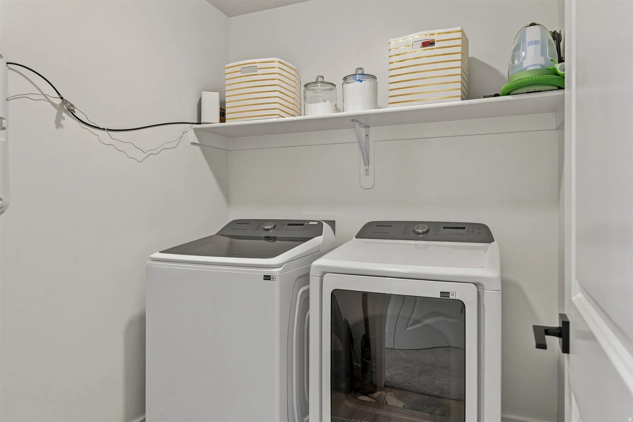 White laundry appliances with a top-load washer and front-load dryer