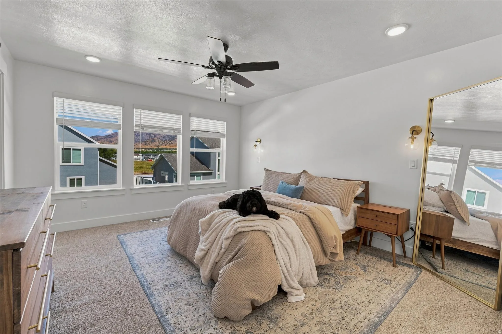 White walls with recessed lighting and a ceiling fan