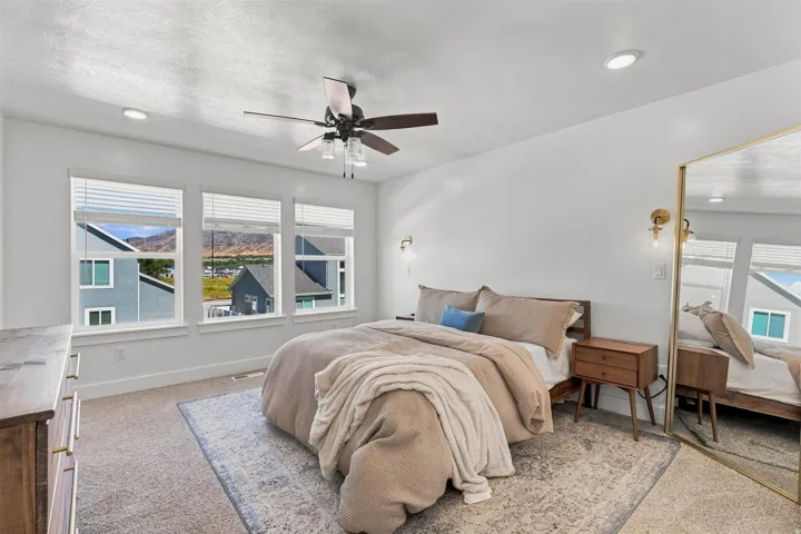 White walls with recessed lighting and a ceiling fan