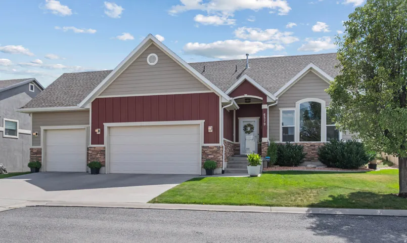 Multi-tone exterior siding with stone accents