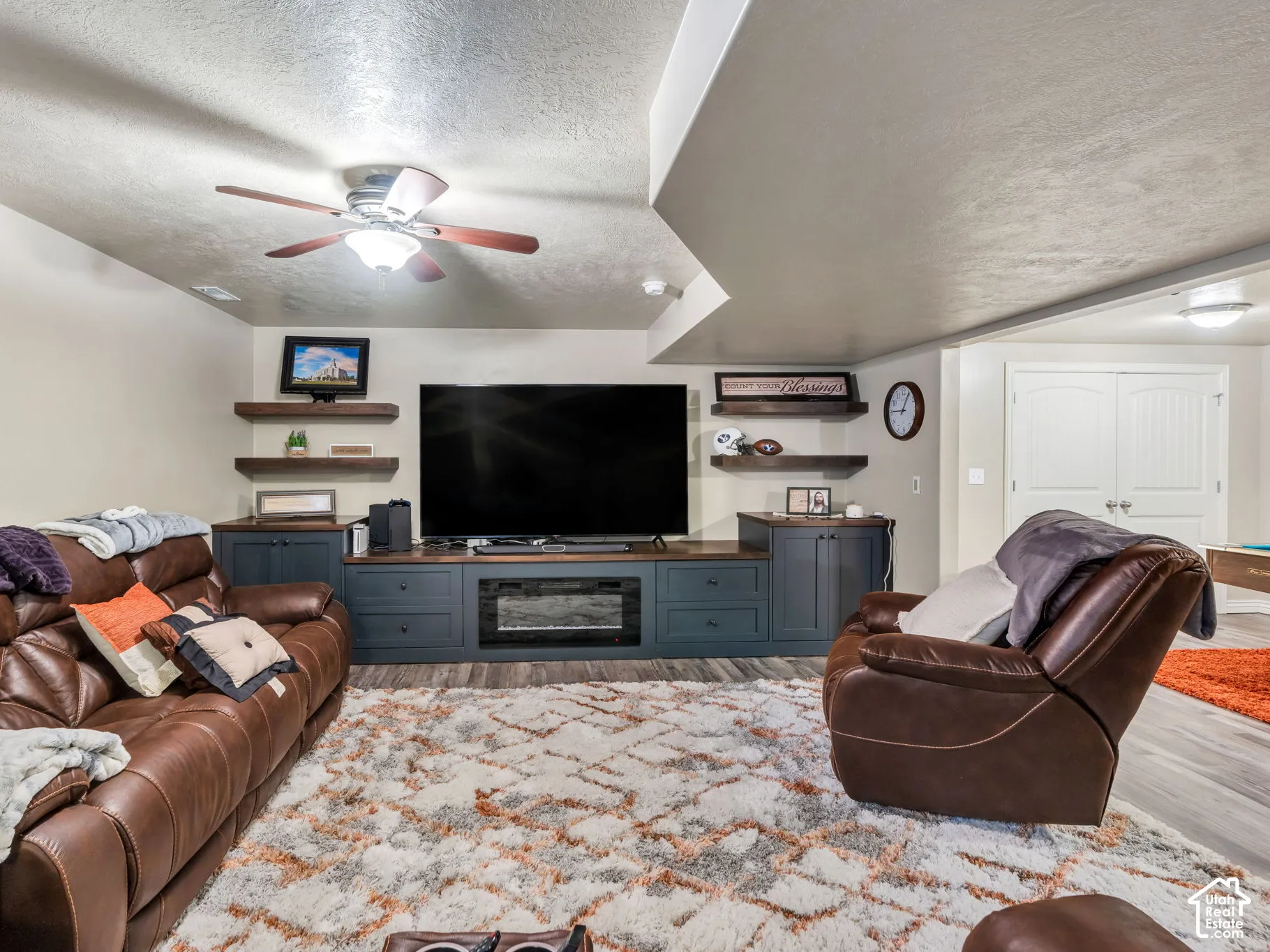 Built-in media console with storage cabinetry and integrated fireplace