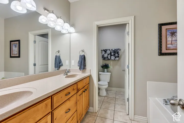 Bathroom featuring Dual sinks, soaker tub with jets, and separate shower