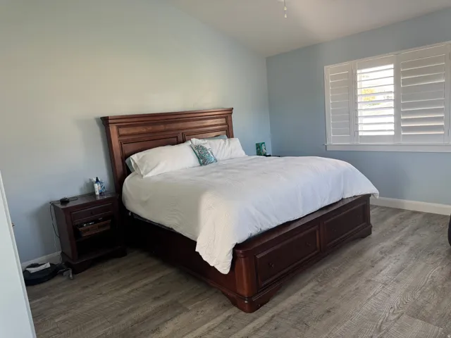 Vaulted ceiling, plantation shutters, Vinyl, and crown molding