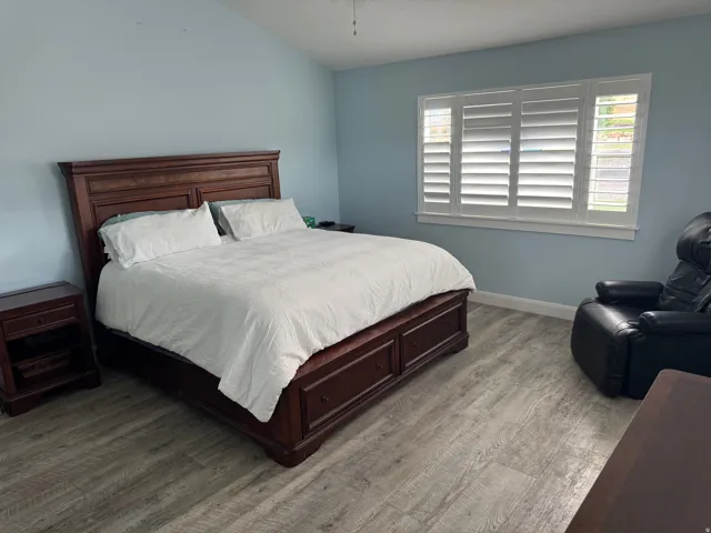 Vaulted ceiling, and white plantation shutters