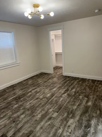 Vinyl flooring with neutral wall paint and white trim